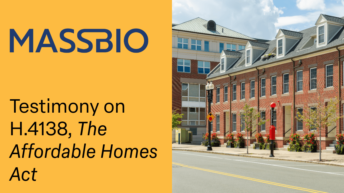 Image of a multi-unit residential building on the right with a yellow background on the left of the image with the MassBio logo and the text: Testimony on H.4138, The Affordable Homes Act.